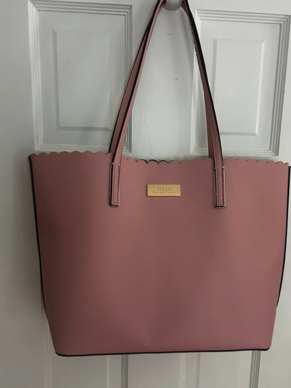 Trina Turk rose pink scalloped tote with gold plaque
